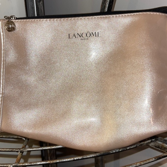 Lancome Handbags - Lancôme pink shiny make up bag never been used nice
